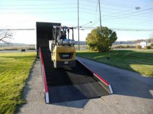 Yard ramp rentals safety | Forklift traveling up Copperloy yard ramp